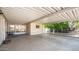 Spacious carport with an attached patio, offering ample parking and outdoor living space at 2400 E Baseline Ave # 197, Apache Junction, AZ 85119