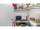 A closet converted into a home office space with a computer, desk, and storage at 2400 E Baseline Ave # 197, Apache Junction, AZ 85119