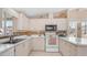 White appliances complement this kitchen that features bright countertops and ample cabinets at 2400 E Baseline Ave # 197, Apache Junction, AZ 85119