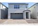 Charming two-story home features a two-car garage and nicely landscaped front yard at 2482 W Rowel Rd, Phoenix, AZ 85085