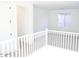 Upstairs loft with neutral carpet and a window allowing natural light at 2482 W Rowel Rd, Phoenix, AZ 85085