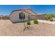 Charming single-story home with a desert front yard, attached two-car garage, and neutral exterior paint at 25539 W Gwen St, Buckeye, AZ 85326