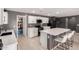 Modern kitchen with white cabinetry, stainless steel appliances, and a convenient center island at 25539 W Gwen St, Buckeye, AZ 85326