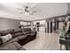Open-concept living space features tile flooring, neutral paint, and seamless flow to the kitchen at 25539 W Gwen St, Buckeye, AZ 85326