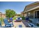 Cozy backyard seating area with a fire pit, artificial grass, and mountain views at 26141 N 133Rd Ave, Peoria, AZ 85383