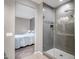 Stylish bathroom featuring a glass-enclosed shower and views into the bedroom at 26141 N 133Rd Ave, Peoria, AZ 85383