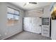 Spare bedroom with a Murphy bed, a window and neutral colors at 26141 N 133Rd Ave, Peoria, AZ 85383