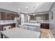 Modern kitchen features a large center island, stainless steel appliances, and pendant lighting at 26141 N 133Rd Ave, Peoria, AZ 85383