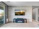 Stylish living room features a brick accent wall and modern entertainment center at 26141 N 133Rd Ave, Peoria, AZ 85383