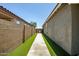 Easy to maintain side yard with artificial turf and walkway at 26141 N 133Rd Ave, Peoria, AZ 85383