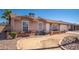 Charming single-story home featuring a well-maintained exterior with a brick accent wall and desert landscaping at 307 W Piute Ave, Phoenix, AZ 85027