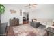 Spacious living room featuring hardwood floors, a stylish rug, and a comfortable sofa at 307 W Piute Ave, Phoenix, AZ 85027