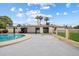 Beautiful backyard featuring a round pool, covered patio, and well-maintained landscaping at 3707 E Amelia Ave, Phoenix, AZ 85018