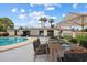 Picturesque outdoor dining area with a view of the pool and modern home exterior at 3707 E Amelia Ave, Phoenix, AZ 85018