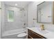 Bathroom features modern fixtures, marble-like tiled walls, and a sleek vanity, offering a luxurious feel at 3707 E Amelia Ave, Phoenix, AZ 85018
