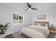 Bedroom with natural light, paired with a contemporary decor and cozy linens, makes it a tranquil retreat at 3707 E Amelia Ave, Phoenix, AZ 85018