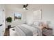 Bedroom with a neutral palette, complemented by an elegant painting and a comfortable bed with soft linens at 3707 E Amelia Ave, Phoenix, AZ 85018