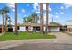 Charming home with manicured lawn, mature trees, and a welcoming facade at 3707 E Amelia Ave, Phoenix, AZ 85018