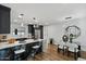 Open concept kitchen features a marble island, stainless appliances, and modern lighting at 3707 E Amelia Ave, Phoenix, AZ 85018
