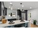 Contemporary kitchen boasting stainless steel appliances, marble counters, and designer fixtures at 3707 E Amelia Ave, Phoenix, AZ 85018