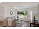 Inviting living room with modern decor, lots of natural light, and hardwood floors at 3707 E Amelia Ave, Phoenix, AZ 85018