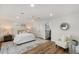 Spacious main bedroom with a white ceiling fan, recessed lighting and a stylish area rug at 3707 E Amelia Ave, Phoenix, AZ 85018