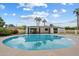 Gorgeous backyard with a sparkling pool, covered patio, and swaying palm trees at 3707 E Amelia Ave, Phoenix, AZ 85018