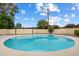 Inviting round pool surrounded by lush landscaping, creating a private oasis at 3707 E Amelia Ave, Phoenix, AZ 85018
