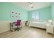 Cozy bedroom featuring a desk area, light-colored plank flooring, and a light-filled window at 3719 E Longhorn St, San Tan Valley, AZ 85140