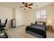 Comfortable bedroom with vinyl floors, a ceiling fan, and a double door closet at 3719 E Longhorn St, San Tan Valley, AZ 85140
