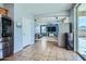 Open-concept living room, seamlessly blending with the kitchen and features a sliding door to outdoor at 3719 E Longhorn St, San Tan Valley, AZ 85140