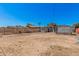 Spacious dirt backyard bordered by chain-link fence and other properties at 3913 W Sherman St, Phoenix, AZ 85009
