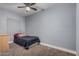 Simple bedroom with wall to wall carpeting, neutral walls, and minimal decor at 3913 W Sherman St, Phoenix, AZ 85009