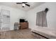 Modest bedroom features wood-look flooring, ceiling fan, and small bed at 3913 W Sherman St, Phoenix, AZ 85009
