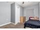 Small bedroom with carpeting, basic furnishings, and neutral color scheme at 3913 W Sherman St, Phoenix, AZ 85009