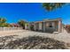 Charming single-story home with gray exterior, white trim, and rock landscaping at 3913 W Sherman St, Phoenix, AZ 85009