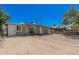 Quaint single-story home with gray siding, gravel yard, and a welcoming front entrance at 3913 W Sherman St, Phoenix, AZ 85009