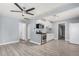 Open kitchen with white cabinets, stainless steel appliances, and stylish gray flooring at 3913 W Sherman St, Phoenix, AZ 85009