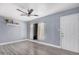 Inviting living room featuring sleek gray flooring, a modern ceiling fan, and natural light at 3913 W Sherman St, Phoenix, AZ 85009