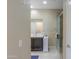 A bright bathroom featuring a glass-enclosed shower and a dark vanity with a light countertop at 41004 W Crane Dr, Maricopa, AZ 85138