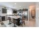 Beautiful kitchen with a large island, stainless steel appliances, and ample counter space at 41004 W Crane Dr, Maricopa, AZ 85138