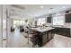 Open concept kitchen with a large island and modern appliances; ideal for entertaining and cooking at 41004 W Crane Dr, Maricopa, AZ 85138