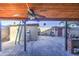 The fenced backyard features a covered patio, a block perimeter fence, and detached storage sheds at 4545 N 67Th Ave # 1101, Phoenix, AZ 85033