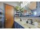 Bathroom featuring double vanity and dark fixtures at 4545 N 67Th Ave # 1101, Phoenix, AZ 85033