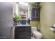 The renovated bathroom showcases black cabinets, a vessel sink, and stylish decor with a modern vanity at 4545 N 67Th Ave # 1101, Phoenix, AZ 85033