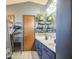Bathroom featuring double vanity and storage shelving at 4545 N 67Th Ave # 1101, Phoenix, AZ 85033