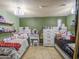 Bright bedroom with two twin beds and central vanity at 4545 N 67Th Ave # 1101, Phoenix, AZ 85033