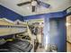 This bedroom features a bunk bed, a ceiling fan, and a functional closet space at 4545 N 67Th Ave # 1101, Phoenix, AZ 85033