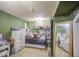 This cozy bedroom features tile floors, shelving, and a stylish mirror enhancing the room's charm at 4545 N 67Th Ave # 1101, Phoenix, AZ 85033