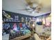 A secondary bedroom has vibrant decor, with a ceiling fan for added comfort in a well-lit room at 4545 N 67Th Ave # 1101, Phoenix, AZ 85033